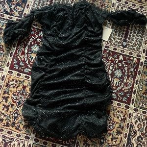 It’s a cute black sparkly dress perfect for holiday parties or dinners or dates.